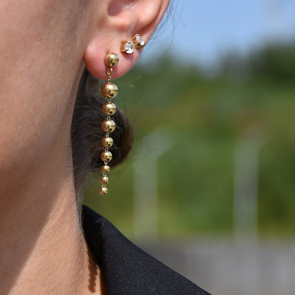 Boucles d'oreilles Alba en acier long boules