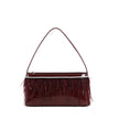 Sac à main en vernis et plumes